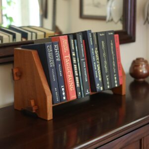 Solid wood desktop bookshelf display holds books in style. A timeless collapsible design with mortise and tenon joinery assembles by hand.